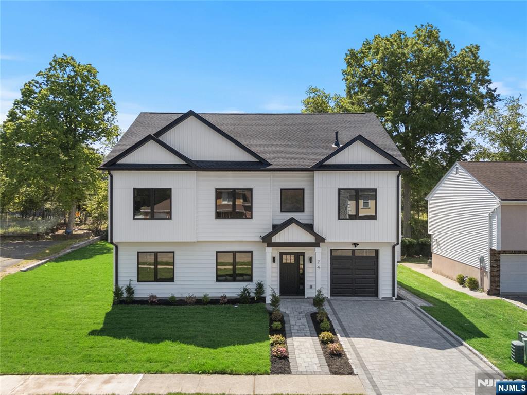 Stunning new construction modern home with an attached garage, thoughtfully designed with luxurious finishes and exceptional living space throughout. This impressive 5-bedroom, 4.5-bath residence features an open and airy layout perfect for both everyday living and entertaining. The first floor welcomes you with a spacious living room, elegant dining area, and a designer eat-in kitchen complete with a large center island, walk-in pantry, and premium finishes, plus a convenient first-floor bedroom ideal for guests or a home office. Upstairs, the luxurious primary suite offers a private retreat with two oversized walk-in closets and a spa-inspired bath. Three additional generously sized bedrooms and two full baths complete the second level. The third-floor loft with a half bath provides the perfect bonus space for a media room, playroom, gym, or office. Step outside to enjoy a beautiful backyard, perfect for entertaining, gatherings, or simply relaxing in your own private outdoor oasis. This exceptional home combines modern elegance, comfort, and functionality in every detail.