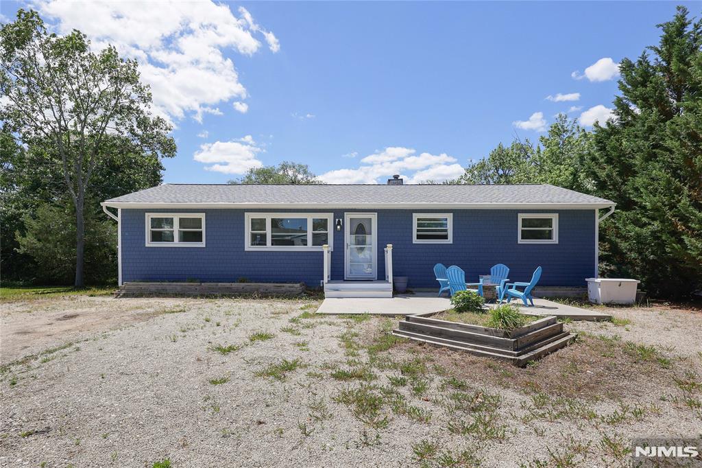 Stop scrolling--your dream home awaits! This beautifully renovated 3-bedroom, 2-bath ranch is tucked away on a quiet residential street just minutes from Jersey Shore beaches, the boardwalk, shopping, dining, entertainment, and major roadways. The open-concept layout features updated flooring, a sun-filled living room with a large picture window, spacious dining area, and an updated kitchen with granite countertops, abundant cabinetry, a center island, and sliding doors leading to the expansive rear deck. The primary suite offers vaulted ceilings, generous closet space, a private bath, and direct deck access. Additional highlights include a gazebo with electric and ceiling fan, above-ground pool (as is), oversized 2-car garage with heated/cooled bonus room above, ample parking, whole-house
