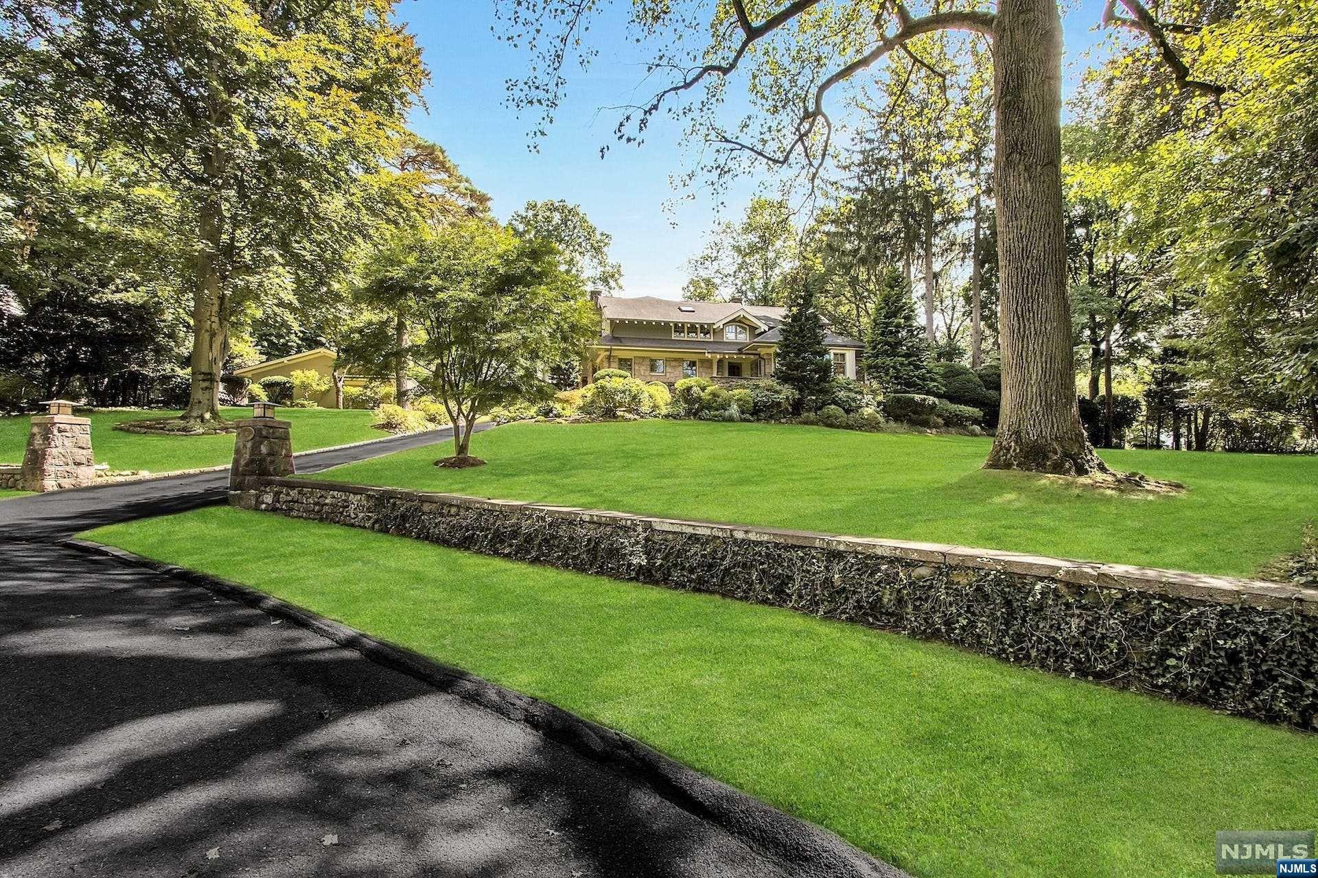 FABULOUS COLONIAL FEATURING 6 BEDROOMS, 6 FULL & 2 HALF BATHS LOCATED ON TENAFLY'S EAST HILL ON APPX. 1 ACRE OF RESORT STYLE PROPERTY WITH A FRESH WATER POOL. AMAZING FLOOR PLAN FOR EVERYDAY LIVING & ENTERTAINING! FEATURING AN OVERSIZED GREAT ROOM W/FP & A WALL OF FRENCH DOORS OVERLOOKING THE LUSH PRIVATE YARD, DINING RM W/BUILT-IN BAR, LR W/FP, SUN-DRENCHED GOURMET KITCHEN W/BRKFST AREA, MUD RM, OFFICE, PR AND GUEST SUITE COMPLETE THIS LEVEL. LARGE PRIMARY SUITE W/SPA-LIKE BATH W/RADIANT HEAT, 2 ENSUITE BEDROOMS, BEDROOM/OFFICE, FULL BATH, BONUS SITTING AREA, LAUNDRY RM & SECONDARY BACK STAIRCASE. LARGE LOWER LEVEL WITH SPACIOUS REC AREA W/CUSTOM BUILT-IN BAR, OVERSIZED GYM, ENSUITE BR, 1/2 BATH & ABUNDANCE OF STORAGE. FABULOUS OUTDOOR OASIS FOR ENTERTAINING, LARGE PATIO, GORGEOUS LANDSCAPING W/SPECIMEN TREES & EXPANSIVE LAWN. 3 CAR GARAGE, HOUSE GENERATOR, SECURITY/CAMERA SYSTEM, INDOOR/OUTDOOR SOUND SYSTEM. TOO MANY UPGRADES TO LIST. BLUE RIBBON SCHOOLS & MINUTES TO MANHATTAN!