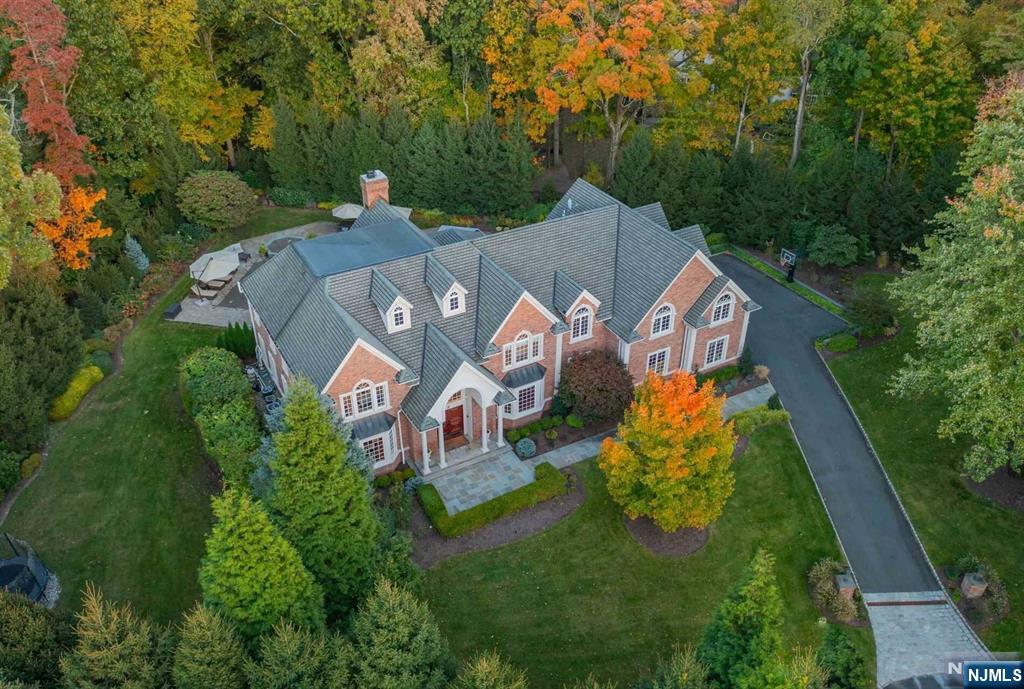 Welcome to one of a kind luxury! This grand estate is situated on a private cul-de-sac in the coveted east hill. Exquisitely renovated brick manor is the epitome of modern living. A bright 2 story entry w/sweeping staircase & fabulous floor plan. Offers an oversized LR & DR, dream kitch is high-end w/ top of the line applnc, seated quartzite isl,& brkfast rm. 2 stry great rm w/fl to ceilg FP & views of a private oasis. Custom billiard rm/library, 1st fl ensuite/office w/full bath, & an indoor cabana that services the outdoors. Mud rm w/access to 3 car heated grg. The oversized prim suite is one of a kind w/private sting rm, 2 cstm boutique closets, & a new spa-like bth w/cstm vanity, shower & soaking tub. The addt'l 3 enst br's are generous size. The outdoors is spectacular & private, w/a gunite pool, spa, FP & outdoor ktchn. The lower lVl is a haven, features a media rm w/bar, hockey rink, dance studio, gym , rec area. Smart home, generator, too many amenities to list!