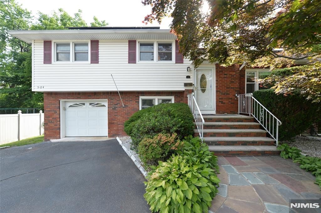 Call us today 201-398-9898 Welcome home! And that is exactly the feeling you will get the moment you step inside this well-loved home in Fair Lawn. Upon entry, you are welcomed by an inviting foyer, the perfect place to kick off your shoes & put your keys down after a long day. This flows effortlessly into a sun-drenched living room, flooded with natural light & ready to usher you into a state of peace. Adjacent is the dining room, the perfect setting to gather, host, & enjoy good company over a warm meal. Overlooking it all is the beautifully updated kitchen featuring tasteful backsplash, granite countertops, stainless steel appliances, & not one, but TWO ovens, holiday baking, dinner parties, & meal preps just got a whole lot easier! The second floor showcases two spacious bedrooms, a full hallway bathroom, & a primary suite complete with an en-suite bath, because you deserve your own retreat. Upstairs, the third floor offers a private bedroom with endless possibilities: a future expanded primary suite, reading retreat, office, or creative space.Need more room? This home delivers! The ground level features a family room, powder room, laundry, & garage access, while the finished basement offers a rec room, home gym, & utility space. And the cherry on top? A peaceful backyard patio overlooking lush green grass, the perfect place to unwind after a long day. All of this in the sought-after town of Fair Lawn, close to everything you love. Sign you up already, right?
