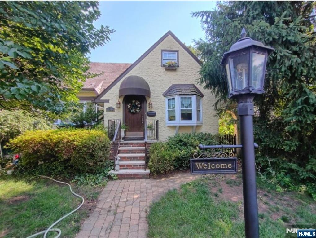 Delayed listing available to see on 7/14/26. See this beautiful tranquil home in the quaint town of Hohokus! Set on a mature landscaped lot, designed by Landscape Architect Mike Barone, privacy abounds, yet not far from town. Three bds, 1.5 bths- kitchen boasts stainless appliances, granite counters & a Wolf stove. Convenient 1st floor bedroom, that is currently being used as a den, sunroom & beautiful wood burning fireplace in the livingroom. Two zone central air. Backyard boasts of paver courtyard & a separate 3 season workspace or cottage. Durable & charming slate roof. Close to schools, parks & transportation. Come see, this one won't last!