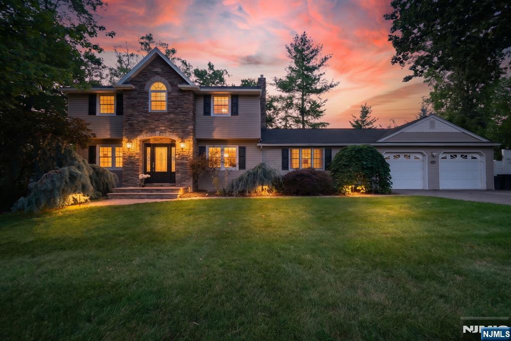 Nestled in one of Wayne's most desirable sidewalk-lined neighborhoods, this beautifully maintained center hall Colonial offers timeless style, spacious living, and an exceptional backyard retreat. Gorgeous curb appeal is highlighted by newer siding, an elegant stone facade, and a welcoming front entrance. Inside, beautiful hardwood floors enhance the spacious living room and formal dining room, while the eat-in kitchen opens to a stunning great room addition, creating the perfect space for everyday living and entertaining. Upstairs features four generously sized bedrooms and 2.5 baths, including a spacious primary suite. The finished lower level adds even more versatile living space with durable synthetic flooring, elegant wainscoting, abundant closet space, a home gym, and sauna (included with the right offer). Step outside to your private backyard oasis featuring a fenced yard, sparkling inground pool with a new liner, new cover, and safety fence, newer paver patio, and storage shed - perfect for relaxing or entertaining all season long. Enjoy everything Wayne has to offer, including highly rated schools, parks, recreation, shopping, dining, and convenient access to Routes 23, 46, 80, 287, NJ Transit, Pompton Plains, and the Bergen County border. A wonderful opportunity to enjoy the lifestyle, comfort, and convenience that make Wayne one of Northern New Jersey's most sought-after communities.