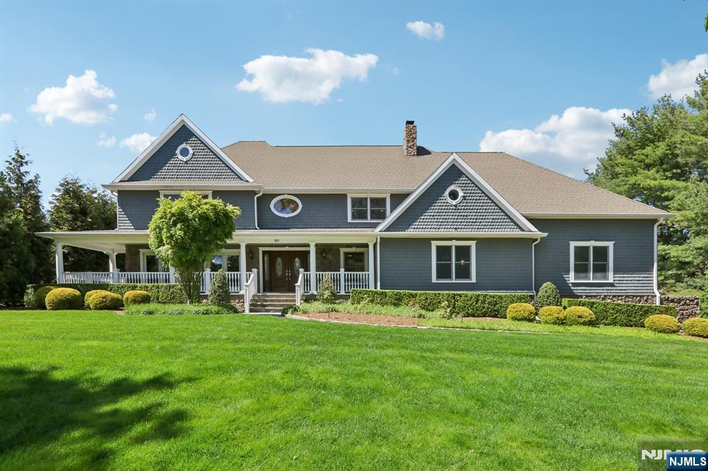 Set on approximately one acre in beautiful location, this great home offers the perfect blend of comfort and exceptional outdoor living.The spectacular backyard feels like a private resort, featuring an in-ground pool, charming pool house, elegant bluestone porches, a beautiful pergola, and an incredible covered porch complete with a built-in kitchen , heating lamps, and automatic shades-creating the ultimate setting for year-round entertaining and everyday enjoyment. Inside, the homes offers five spacious bedrooms and desirable open layout highlighted by front-to-back great room filled with natural light. The beautifully updated kitchen features a large center island and flows seamlessly into the main living areas. A grand-sized dining room with French doors creates an elegant space for gatherings and special occasions, while the inviting living room showcases a beautiful fireplace and custom built-ins, adding warmth and sophistication. A finished basement provides additional recreational and living space. Completing this exceptional property is welcoming front lemonade porch, adding timeless charm and curb appeal to this truly special home.