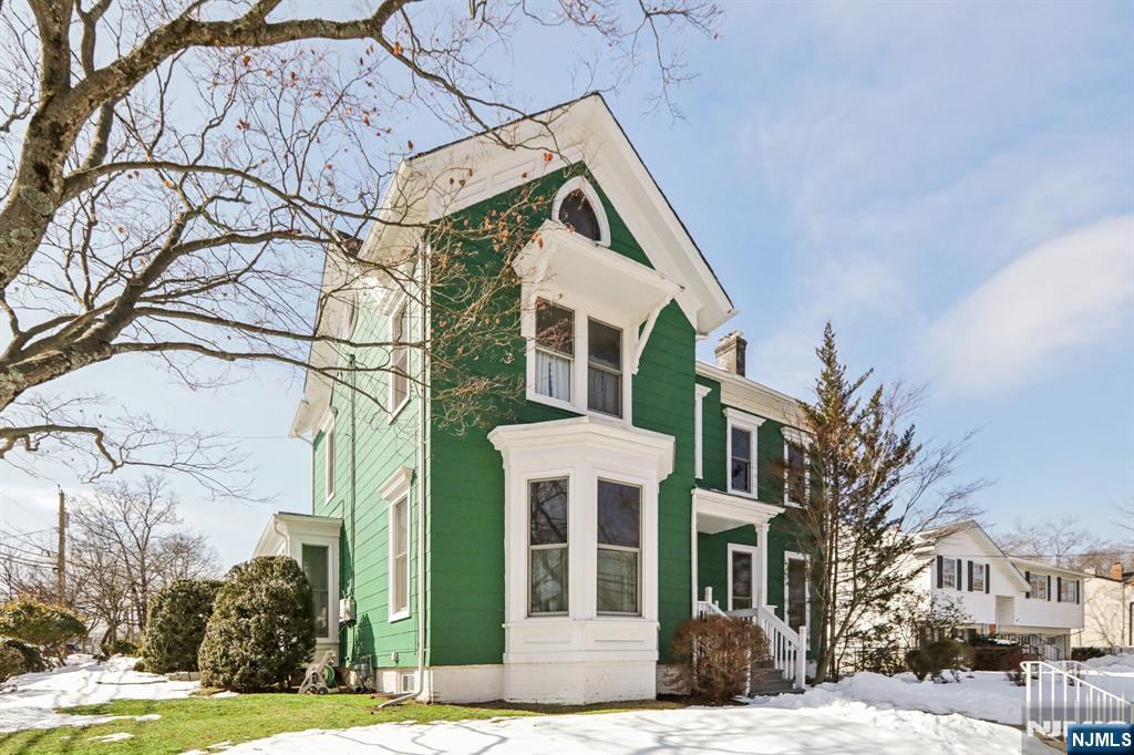 call Gary 201-776-6000 for a private showing. Step into timeless charm with this beautifully preserved 1890 Colonial-style home, offering 4 bedrooms and the classic architectural details that make historic homes so special. From the moment you enter, you'll notice the soaring high ceilings that create an airy, open feel throughout the home. Large windows flood each room with natural light, highlighting the elegant proportions and period character. The generous living spaces provide the perfect balance of historic charm and everyday comfort, ideal for both relaxing and entertaining. The four plus bedrooms offer flexibility for family, guests, or a home office, while the traditional Colonial layout provides distinct yet flowing living areas. Original details such as classic moldings, tall doorways, and expansive hallways add warmth and authenticity that are rarely found in newer construction. Outside, the home's classic Colonial facade reflects the craftsmanship of the late 19th century, with symmetrical lines and timeless curb appeal.