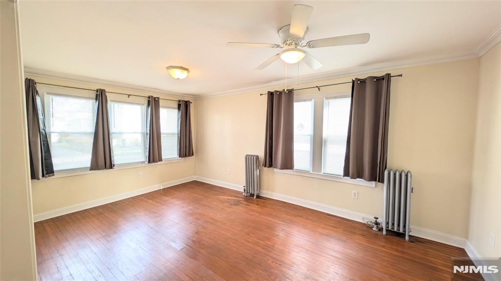Spacious and bright 5 room 1st floor apartment! Large living room, Updated modern kitchen with granite countertops, stainless steel stove, microwave and fridge included. 2 full size bedrooms, formal dining room and updated full bath. Large walk in hallway closet and additional cabinet storage. Shared washer and dryer in basement provided by landlord. Shared used of yard. Tenant pays own utilities. Street parking only. Sorry, no smoking and no pets. Landlord requires 1.5 months security deposit, rental application, credit report (credit must be in EXCELLENT standing), income verification, proof of identity and interview required. Close to parks, shopping, restaurants and NYC transportation.