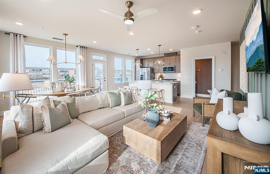 Spring Sales Event now active - limited opportunities remaining! Discover a vibrant blend of comfort, convenience, and connection at Bridgeview - a stunning new construction townhome community in commuter-friendly Kearny, NJ. Perfectly positioned for effortless travel, Bridgeview offers quick access to major highways, the PATH train to NYC, and Newark Liberty Airport - making it an ideal home base for busy professionals and frequent travelers alike. This beautifully designed Greenwich Townhome is an end-unit home and features 3 spacious bedrooms, 2.5 bathrooms, and is thoughtfully set away from the main road, offering a peaceful retreat with added privacy. Inside, you'll find open-concept living areas, sleek modern finishes, and low-maintenance design - creating a space that's both stylish and functional. Step outside your door and enjoy resort-style amenities, including a sparkling pool, fitness center, elegant club room, co-working lounges, outdoor grilling areas, dog runs, and a shuttle to the PATH station. Plus, you're just a short stroll from everyday essentials and local favorites like Starbucks, LA Fitness, ShopRite, Target, BJs, and a variety of dining and entertainment options. Whether you're seeking elevated living, unbeatable convenience, or the perfect commuter location - the townhomes at Bridgeview check every box.