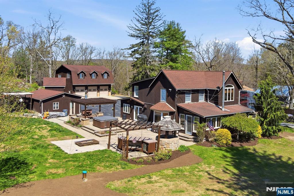 One-Of-A-Kind Craftsmanship With Everyday Function In This Thoughtfully Designed Property. The Custom Eat-In Kitchen Features A Breakfast Bar, Beamed Ceilings, Remote Skylights, Granite Countertops, Radiant Heat Beneath Penn Dutch Hardwood Floors, Commercial-Grade Dacor And KitchenAid Appliances, Bronze Cast Farmhouse Sink, Prep Sink, Electric Fireplace, And Built-In Desk. The Home Offers All-New Lighting, Beautifully Renovated 2025 Bathrooms, A New 500+ Ft Drilled Well With The Original Well That Can Be Used For Irrigation, New Water Softener And Well Tank, On-Demand 240 Gallon Hot Water Tank, Central Vac, Surround Sound, And Pocket Doors Leading To A Sunroom With Wood-Burning Stove And Walkout To The Patio With Outdoor Fireplace And Fire Pit. The Second Floor Includes 3 Bedrooms And 2 Full Baths, Including A Primary Suite With Private Full Bath And Walk-In Closet. Exterior Highlights Include A Large Paver Patio, Kohler Whole-House Generator, Detached 24'x22' Ice House With Upper/Lower Storage And 50-Amp Service, Plus A 35'x42' (1,470 Sq Ft) Oversized 3-Bay Garage With 200-Amp Panel, And Car Lift Ready. Additional Features Include 50-Amp RV Service And 2-Car Garage With 50-Amp Electric. Ideal For Car Enthusiasts, Hobbies, Or Entertaining Year-Round. Close To Route 23 And Just 1 Hour To NYC! So Much To See And Opportunities Like This Are Few And Far Between!