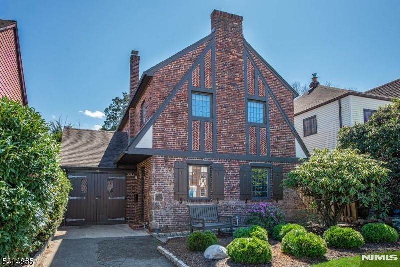 Situated on one of the prettiest streets in the Allwood section is this charming brick Tudor with amazing curb appeal! Step inside and you will immediately be impressed with the spacious living room, with a beamed ceiling and floor to ceiling custom built-in bookcases that flank the front door. Continue through the arched doorway to the formal dining room leading to the updated eat-in kitchen, with wood cabinets, granite counters and stainless steel appliances (kitchen table with matching granite top is included.) Beyond the kitchen is a raised screened porch --the perfect place to relax as you overlook the private, flat, fully fenced yard. On the second floor, you will find 3 bedrooms (2 of which have cedar closets) plus an updated full bath. The lower level offers a finished section which is the perfect rec room. In addition, there is a powder room, a utility room/storage room/laundry room plus several storage closets. Beautiful hardwood floors & leaded replacement windows throughout. Brand new furnace & electric box! One car garage also has storage space. Windsor Road is a dead end street with access to four bus routes at the end of the block, all that take the commuter directly to NYC! At the other end of the block is a neighborhood playground. This street is perfectly located just a short walk to restaurants & shops on Allwood Rd, Market St & the Styertowne shopping area. The Allwood Park & Ride and Rte 3 are both a short distance away! Great house! Great location!