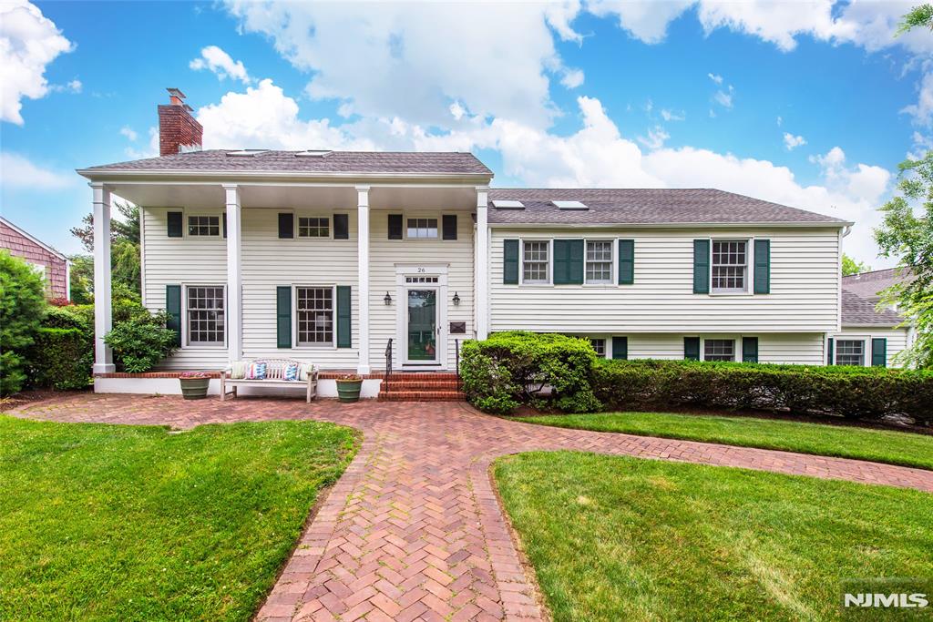 The formal columned, beautifully maintained exterior of this colonial home belies the comfortable lifestyle that awaits within. The mid-century modern floor plan adapts to every lifestyle....open floor plan but private spaces. A spacious entry foyer with guest closet opens to a living room with fireplace& book shelves. Two lovely clamshell builtins enhance the dining room, perfect for displaying some of art or other precious decor. Adjacent to the dining room is a 3 season porch. An updated eat-in kitchen adjoins both. Then a few steps down to a family room with sliders to the yard. Nearby powder room, laundry room, garage entrance & basement entrance complete that level..Bonus!! Drive into your attached garage on rainy or snowy days. A few steps up from the entry way find private space. Primary bedroom has newly renovated bath & loads of closets. Double sized bedroom & hall bath afford ample flexible space. Then a few steps to 2 additional bedooms/office & bath on 3rd level. Entrance to the attic is also on that level. Between the basement & attic, there's no need to rent those ubiquitous storage units for luggage or holiday decor. Situated on a landscaped lot, close to two parks, this is a perfect place to land. Flexible living from formal to casual. Idyllic, quiet location...close to Yantacaw Brook park.