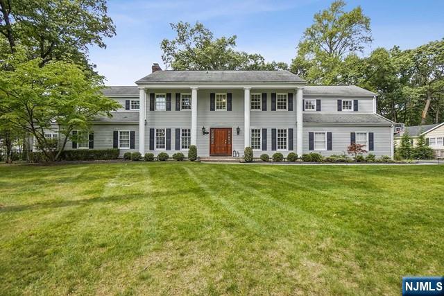 Modern elegance from the moment you enter this sprawling 5400 sq ft colonial in the heart of Wyckoff. The stunning open, white kitchen with upscale appliances and gorgeous quartz countertops overlooks a breakfast room and oversized family room with custom built-ins and wood fireplace. Perfect space for entertaining as the French doors open to a very private backyard and new paver patio. The first floor amenities continue with a sound proofed movie theater, entertaining room with built in bar, and private office ideal for work from home space. Upstairs are 5 large bedrooms, 2 ensuite, laundry & closets galore. A finished basement with multiple rooms for everyone to enjoy. Professionally landscaped, newly painted, floors finely refinished, are just some of the reasons to make this one truly a rare find.
