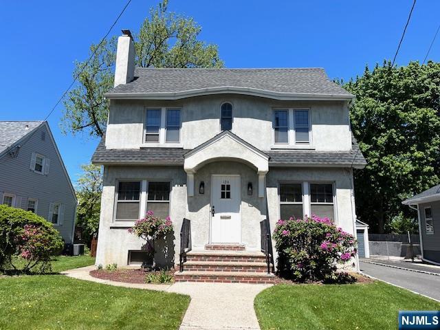 Welcome to this beautiful colonial central hall. The main level features a bright and large living room with fireplace, formal dining room, kitchen, with sliders to a large deck and a beautiful backyard. There are three comfortable bedrooms on the second floor and a full bath. Walk up attic. Basement has high ceilings, with a lot of potential space. One Car garage. Close to NY transportation, schools, parks, shopping, dining and easy commuting with access to Routes 46 & 80, NJ Turnpike.