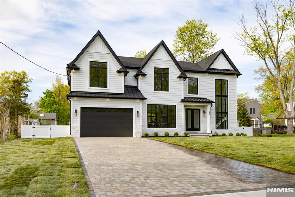 Welcome to 40 Godfrey Terrace, a distinguished new construction home in the heart of Glen Rock Boro, NJ. This exceptional property offers six spacious bedrooms and five and a half well-appointed bathrooms, designed to accommodate modern living with style and comfort. The home boasts a fully finished basement, perfect for additional living space or entertainment. The gourmet kitchen is equipped with new, state-of-the-art appliances, ideal for culinary enthusiasts. The open floor plan allows for an abundance of natural light, enhancing the home's inviting atmosphere. The living area features a cozy fireplace, providing warmth and ambiance during cooler months. The primary bedroom is a private retreat, complete with a luxurious ensuite bathroom and a generous walk-in closet. Additional amenities include a dedicated movie theater and a gym, catering to all your entertainment and fitness needs. A two-car garage offers convenience and ample storage space. The property is situated in a desirable neighborhood, known for its community spirit and excellent schools. This home is a rare find, combining modern amenities with a prime location. Experience the best of Glen Rock living at 40 Godfrey Terrace. Schedule your private viewing today.
