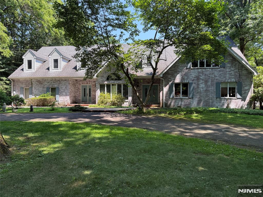A true all brick Southern colonial on a magnificent , flat 2.53 acre parcel on a double cut-de-sac in the heart of Saddle River. This is a spacious 6 bedroom, 4 1/2 bath home with a very desirable barn and paddock, perfect for the equestrian or car collector. Build your dream home or renovate on this magnificent, oversized lot!! House being sold "as is'