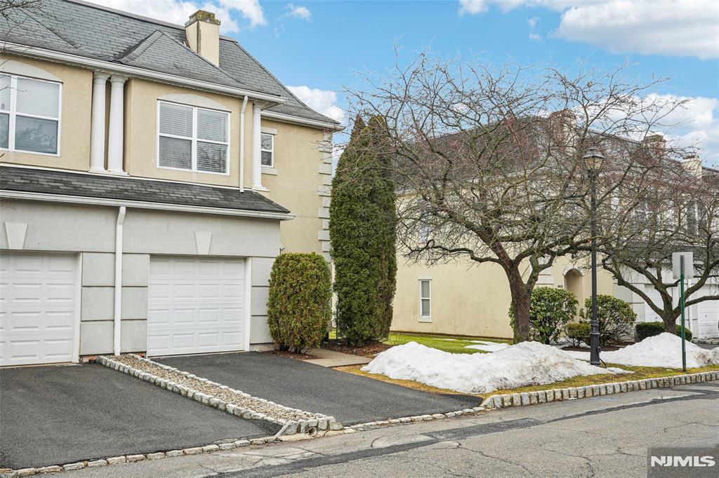Amazing location at Brittany Chase: an updated three-bedroom townhome with a fully finished basement- all ready for you to move right in- Welcome home! Features include: New floors and freshly painted (3/2026) creating a bright, open floor plan. Very spacious living and dining room with a gas fireplace. The kitchen features stainless steel appliances and a charming breakfast room; the entry includes a large closet and a powder room. Double french doors lead to the patio and community courtyard area for your outdoor enjoyment. Second floor includes- Primary bedroom: impressive tray ceiling, a huge walk-in closet, and a private bathroom suite: stall shower, soaking tub and vanity with double sinks and marble countertops. 2 large bedrooms, a full bath, and a conveniently located laundry room. Full finished heated basement: 2 recreational rooms with 2 wonderful storage closets. Additional attributes: New furnace and Central air (2025) great home for entertaining, tons of windows and natural light, recessed lighting, newer custom blinds and one car garage. Enjoy Community life: Outdoor pool, club house, gym, & tennis courts. Wonderful location. Top rated school system, town community activities and sports programs. Minutes to shopping, Traders Joes, Whole Foods, Wayne Public Library, restaurants, park, pharmacy, major highways, and NJ Transit Bus and Train Center, and bus stop.