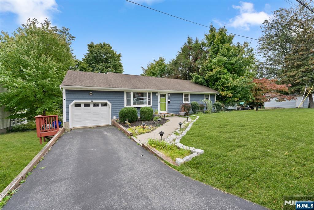 Located near the scenic Mirror Pond in Lake Parsippany, this charming and spacious Ranch-style home is ready to welcome you! Featuring 4 bedrooms, 2.5 baths, and an abundance of natural light, this home offers comfort and convenience. The main level boasts an inviting open-concept living and dining area, complemented by a modern kitchen with stainless steel appliances and a breakfast bar. The fully updated walkout basement expands the living space with two generous family/bonus rooms one with a cozy fireplace perfect for a guest suite or mother-daughter setup. A second full bath, a large laundry room with a slop sink, and ample storage complete this level. Step outside to enjoy the serene patio and spacious backyard, ideal for entertaining or relaxing. With central AC throughout and a prime location, this home is a must-see!
