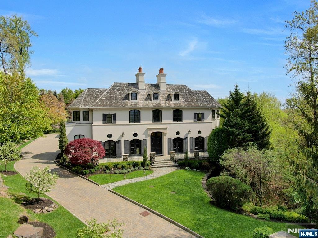 NEW YORK CITY VIEWS! WESTERN SUNSET VIEWS! PERCHED MAJESTICALLY AT THE HIGHEST POINT IN ALL OF ALPINE! PANORAMIC VIEWS WRAPPING THE CUL-DE-SAC OF AUTUMN TERRACE. THIS HOUSE BOASTS APPROX. 12,000 SQ.FT. OF LUXURIOUS LIVING SPACE FEATURING 5 PUBLIC RECEPTION ROOMS, A LARGE CHEFS KITCHEN AND A ROTUNDA RECEPTION FOYER. THE 2ND FLOOR HAS 2 PRIMARY BEDROOM SUITES EACH W/A SITTING ROOM, AND ONE WITH A YOGA STUDIO, ALONG W/ 4 FAMILY BEDROOMS AND BATHS. 2 SEPARATE STAFF BEDROOMS. THE THEATER, GYM, SECOND KITCHEN AND ENTERTAINMENT ROOM ARE ALL FEATURED ON THE LOWER LEVEL W/ HIGH CEILINGS. MAGNIFICENT POOL, GREEN HOUSE, AND VEGETABLE GARDEN ALL COMPLIMENT THE SOUTH GROUNDS. ACROSS THE CUL-DE-SAC, AN ADDITIONAL NEW CONSTRUCTION 5,000 GUEST HOUSE IS AVAILABLE ON A 2 ACRE LOT. (#18 AUTUMN TERRACE, OFFERED AT $6,900,000.) W/A SENSATIONAL 1,500 SQUARE FOOT TWO-STORY GREAT ROOM, WET BAR, CHEFS KITCHEN, OFFICE, MEDIA ROOM, ALL W/EGRESS TO BEAUTIFUL STONE PATIOS AND AN OUTDOOR FIRE PIT WHILE ENJOYING SWEEPING SUNSET VISTAS TOWERING OVER THE NORTHERN VALLEY. THE GUEST HOUSE ALSO HAS AN ADDITIONAL 2 BEDROOMS W/3 FULL AND 2 HALF BATHS. BOTH HOUSES HAVE GENERATORS. 8 MILES FROM NEW YORK CITY!!