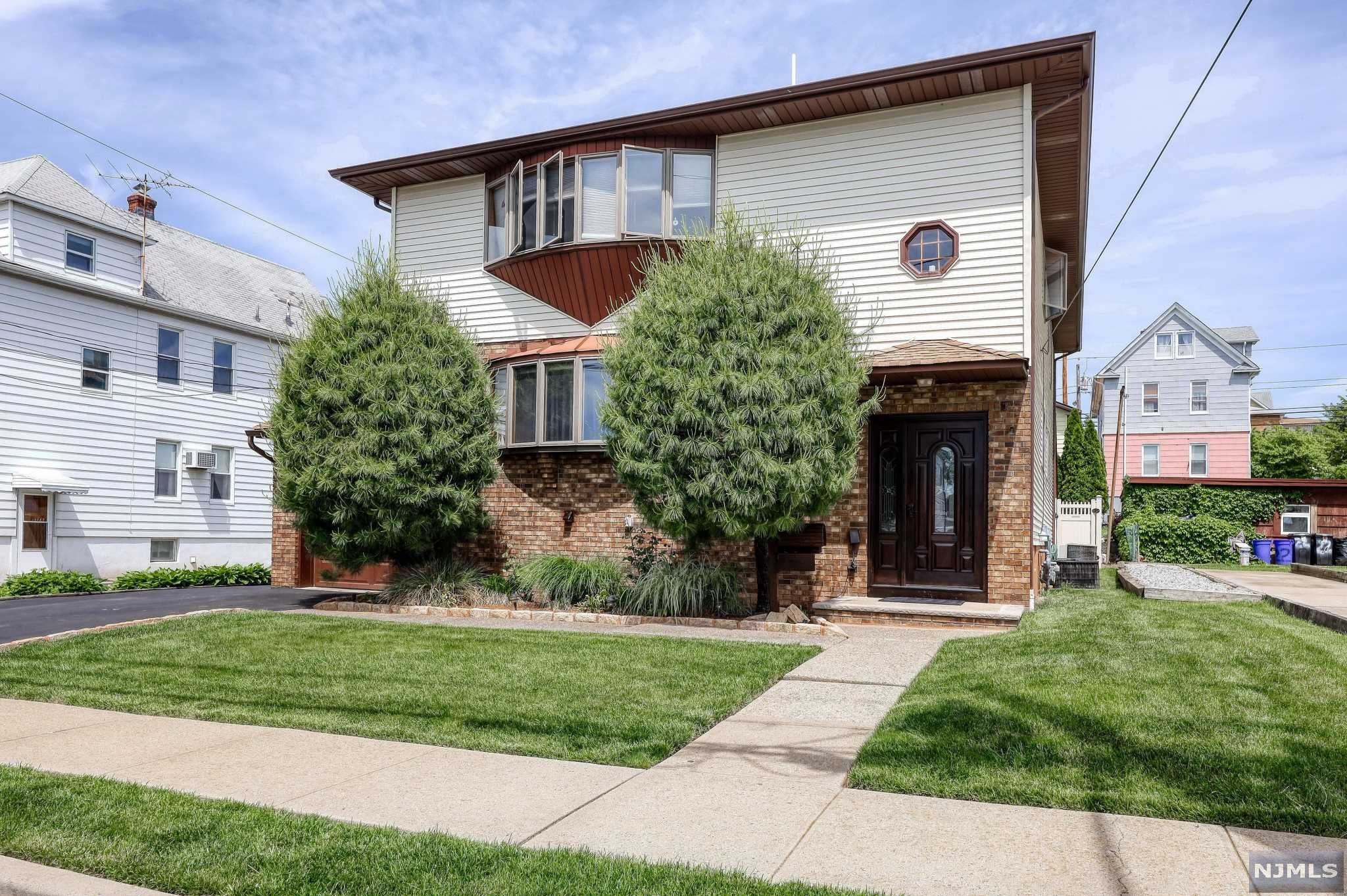 Well maintained newer two family six over six in the center of town. All large rooms, finished basement, family room with wood burning fire place, two decks. Pride of ownership.