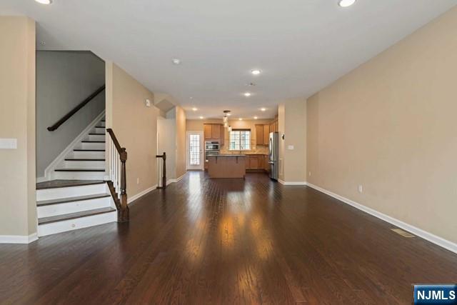 Move-in ready now! Spacious and beautifully upgraded 4-bedroom, 3.5-bath home offering approximately 2,000 sqft of thoughtfully designed living space. Nestled beside a manicured courtyard for added privacy and greenery, this home features an open-concept living, dining, and kitchen area with stainless steel appliances, hardwood floors, 9â€™ ceilings, custom window treatments, modern light fixtures, abundant storage, washer/dryer, and a spacious approx 20x10 feet deck perfect for entertaining or relaxing. Enjoy 4 parking spaces- 2 GARAGE & 2 DRIVEWAY. Unbeatable commuter convenience with an NJ TRANSIT train station - WESMONT STATION - ON-SITE and NJ TRANSIT bus service to NYC every 10â€“15 minutes. Community amenities include parks, coffee and liquor store, while restaurants, shopping, highways, and hospitals are all nearby. Ideal for busy professionals seeking comfort and convenience. No pets. Renters Insurance required. Credit check and proof of income required.