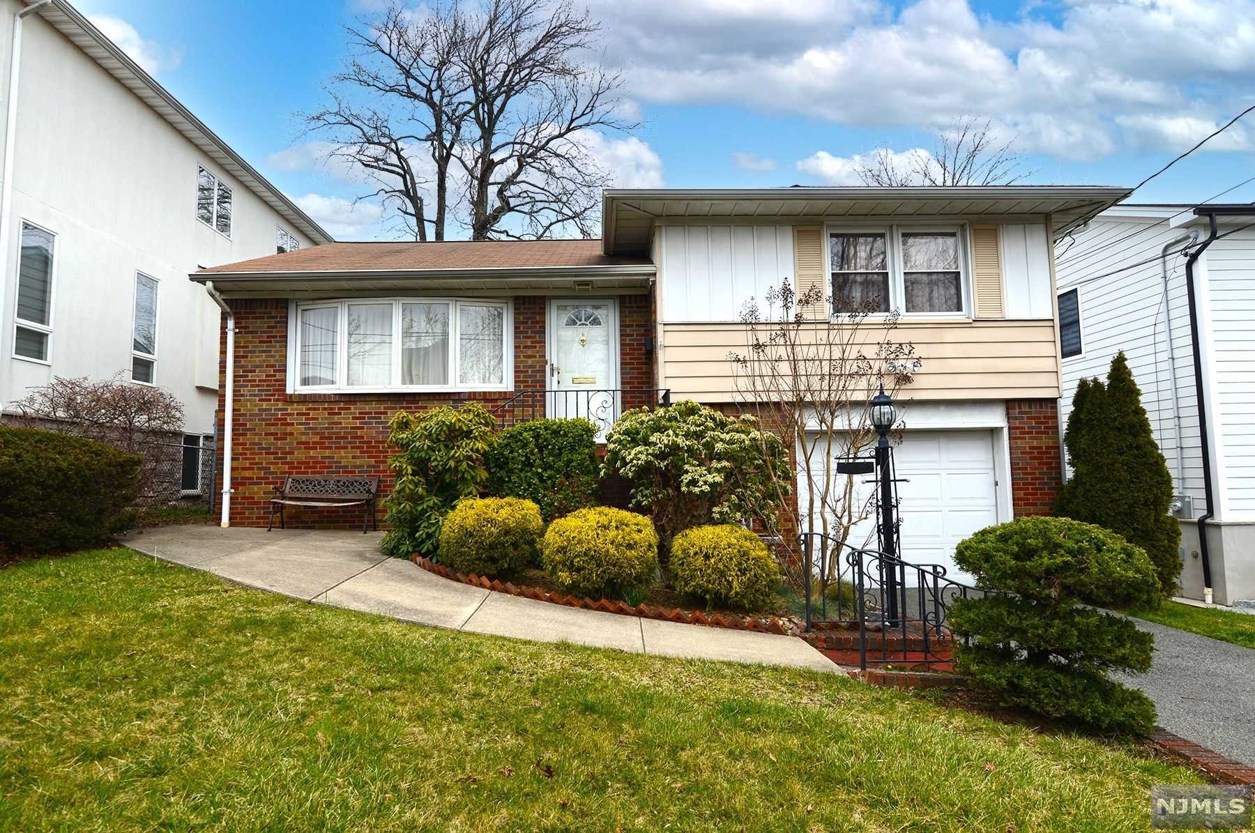You'll be impressed by this beautifully maintained and bright home featuring an elegant living room, dining room, eat-in kitchen with a skylight, four bedrooms and two full baths. There is a separate entrance to the lower level with the 4th bedroom or home office and a finished basement. Enjoy the summer on the deck overlooking the private yard. A newer gas/hot water furnace, central air and hardwood floors are just some of the features of this south facing home. Within minutes to the GWB, NYC and easy access to all NJ highways, Hudson River parks and recreation. This is an amazing and rare opportunity to buy a house in Englewood Cliffs in this price range that you can move in to! Don't miss this one!