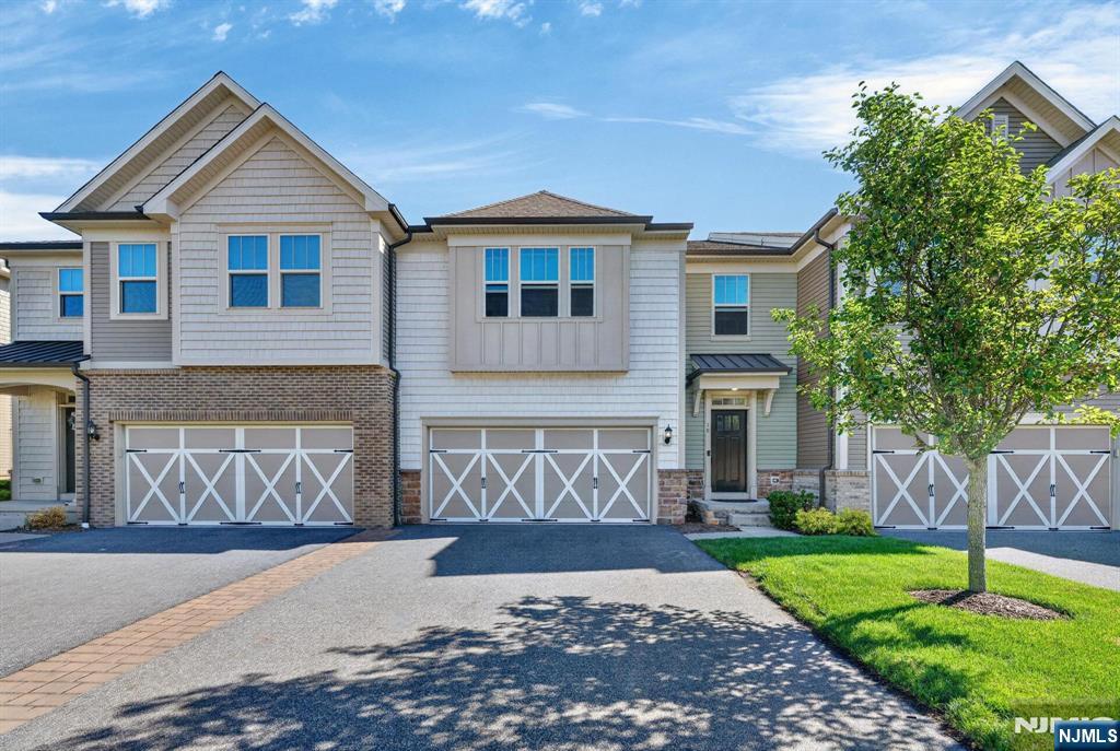 Absolutely stunning Woodcliff Lake townhouse, built only a few years ago and since beautifully remodeled with gorgeous high-end finishes and thoughtful upgrades throughout. This move-in-ready home offers a spectacular floor plan with an elegant entry foyer, formal dining room, formal living room, eat-in kitchen, breakfast room, deck, and attached 2-car garage. Upstairs, the bedroom level features a luxurious primary suite with spa-like bath, two walk-in closets, and private balcony, plus two additional bedrooms, each with its own full bathroom. The fully finished lower level adds incredible versatility with a spacious rec room, private office, half bathroom, utilities, and storage. Enjoy outdoor living on the lovely deck, along with a large driveway and 2 car garage parking. Absolutely nothing to do but move right in and enjoy this beautiful townhome.
