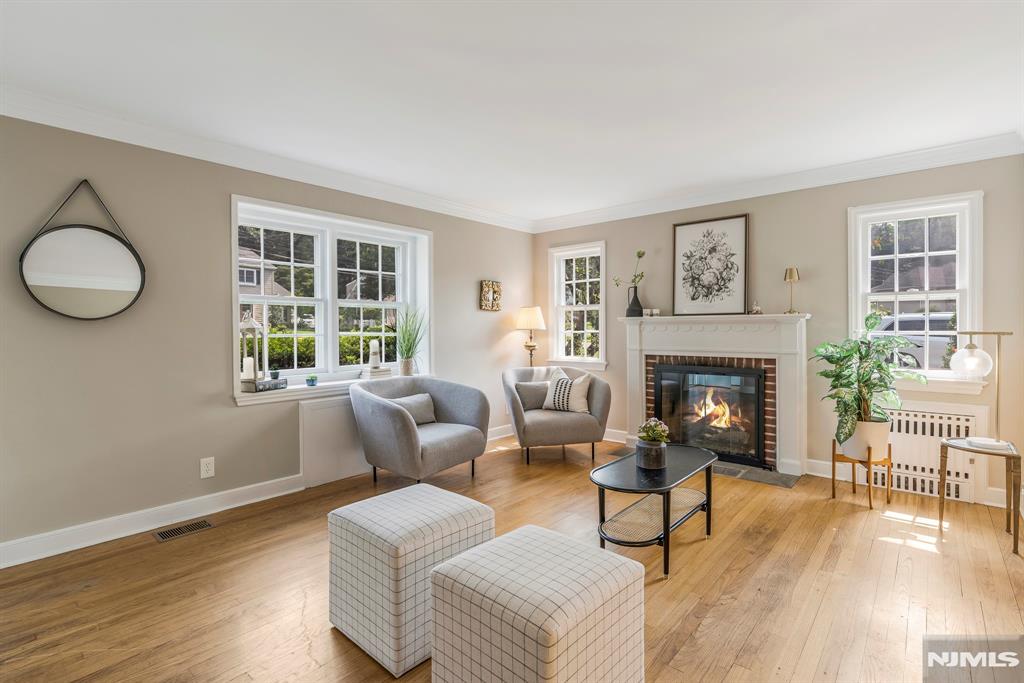Welcome to this storybook cape style home nestled in one of Wyckoffâ€™s most desirable neighborhoods. This 3 (possible 4) bedroom home blends timeless charm with functionality and warmth, boasting sun-filled living spaces and beautiful hardwood floors. The first floor consists of the spacious living room with cozy fireplace, eat in kitchen with stainless steel appliances, dining room and addâ€™l office/den (with window and closet). Rounding out the first floor is a larger bedroom and full bathroom that provide the option for convenient one-floor living and added flexibility. The second floor has 2 more bright ample sized bedrooms and a full bathroom. The charming exterior reveals classic scalloped wood trim detail, a white picket fence and inviting curb appeal that feels like home from the moment you arrive. A large unfinished basement provides endless potential for storage or future expansion. Step outside to enjoy the park-like flat, lush yard, perfect for relaxing or entertaining. All of this plus incredibly low taxes. With a prime location close to top-rated schools, parks, transportation, restaurants and shops, this home is a gem you wonâ€™t want to miss.