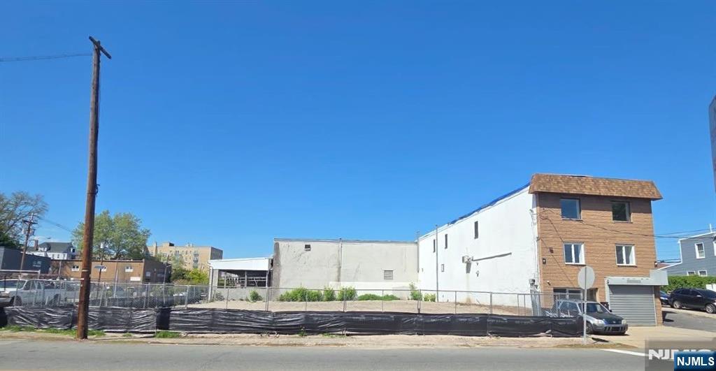 Prime development opportunity. This unique offering consists of three separate parcels totaling approximately 15,000 sq. ft. (150x100 lot). The property includes (62, 64 and 68 Rutgers Street) two vacant lots and one existing commercial building, providing multiple options for investors, developers, or owner-users. Ideal for redevelopment, expansion, or income producing use. High visibility location with strong potential for future growth. Land lease is an option. Buyer to perform due diligence regarding zoning, approvals, and permitted uses. PLEASE DO NOT VIEW COMMERCIAL SPACE WITHOUT APPOINTMENT.