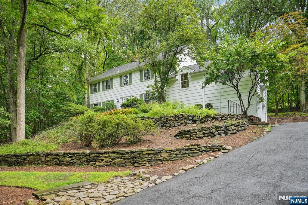 Magnificent Estate on Coveted East Hill in Tenaflyâ€™s Old Smith NBHD. This gracious 4 bdr,3.5 BTH Colonial nestled on 1.25 park-like acres in Tenaflyâ€™s prestigious EH mins to GWB. The FLR, with oversized windows, traditional detailing and FP sets a warm, inviting tone. The DR offers an elegant space for hosting. The EIK provides access to the patio perfect for casual family meals. The expansive FR provides space to relax with family and friends. A dedicated office has access to a screened patio. The primary BDR w/ full en-suite bath, create a restful haven. 3 add'l BDR and 2 baths offer flexibility for F&F. The BSMT has REC RM/gym w/ storage. Outdoors, the property shines w/a generous bluestone patio, landscaping, irrigation and mature trees provide a park-like setting. Add'l features incl. a 2 car GR, central AC, Nat Gas Gen. Move right in and enjoy as-is, or bring your ideas to transform this property into your dream home with custom layout. House being sold "As-is"