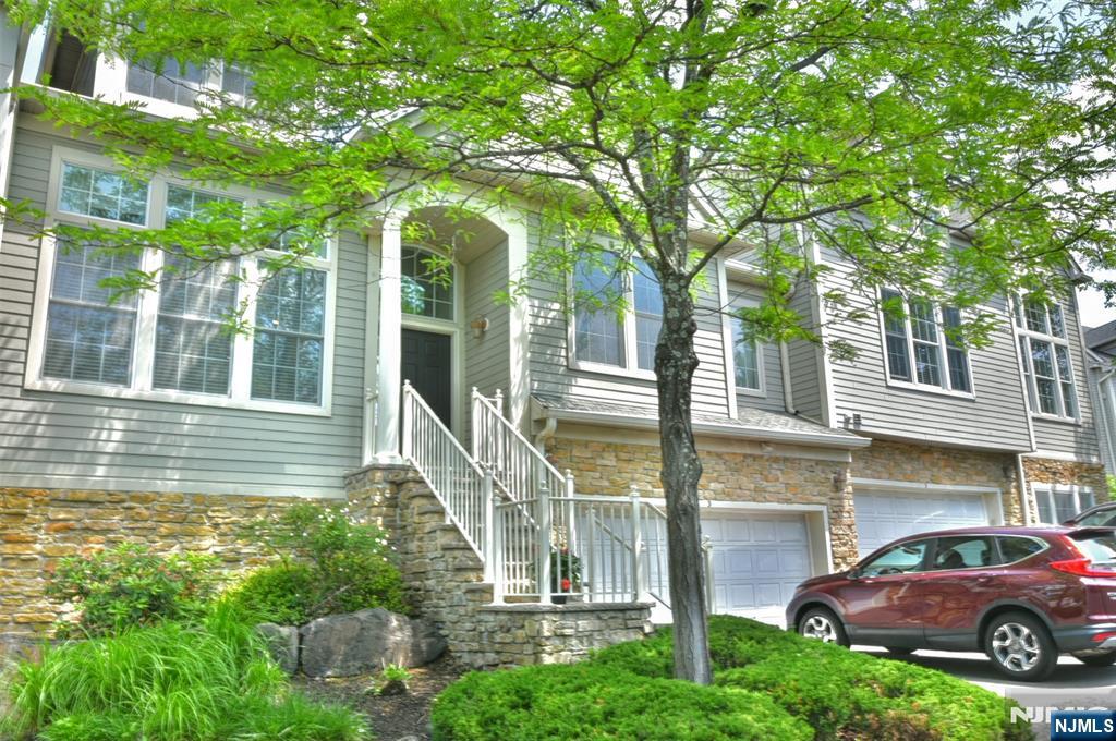Welcome to 3 Skyview Drive in North Haledon's sought-after Summit Pointe community. Where low-maintenance living meets generous space with an easy commute to New York City, designed for effortless everyday living. The first-floor primary suite means single-level comfort when you want it. With soaring two-story ceilings, a wood-burning fireplace, and a private deck that gives you the feel of a much larger home. The open kitchen, living room, and den flow naturally for both quiet nights in and weekend entertaining. Upstairs, a dramatic loft overlooking the living room below offers the perfect home office or flex space ideal for hybrid work schedules. A fully finished lower level with rec room, office, and 2-car garage rounds out a home that truly has room for everything without the burden of maintaining it. HOA covers landscaping, snow removal, and exterior maintenance year-round. Minutes to Hawthorne and Ridgewood NJ Transit stations with under-50-minute service to New York Penn Station. Easy access to Routes 208 and 202. 3 BD 2.5 BA 2-Car Garage Finished Basement Deck Community Pool & Tennis Built 2004 Please call or text Claudia at (201) 638-0718. for showings or information