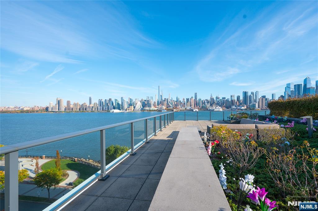 Gorgeous Hudson River Penthouse with amazing views of NYC skyline. Enormous 1500 sq/ft terrace jutting out to the river is an entertainers dream, allowing for large gathering of 75 guests or more. Your guests will be amazed with incredible views from the George Washington Bridge to the Verazano Narrows Bridge. Pamper yourself in the primary bathroom which features large walk in rain shower with glass stall, large soaking tub with ceiling water flow, and double sink. Owner invested over $100,000 in press button window shades while floor to ceiling glass panes allow for plenty of natural light. Amazing 10" floor to ceiling windows with the best views of NYC around.Residents enjoy an ultra modern gymnasium, rooftop swimming pool, media room and lounge. Kitchen has a built-in cigar refrigerator. Unit comes with two parking spots in gated secure garage and two storage units on second floor. Terrace garden maintenance is included in HOA fee.