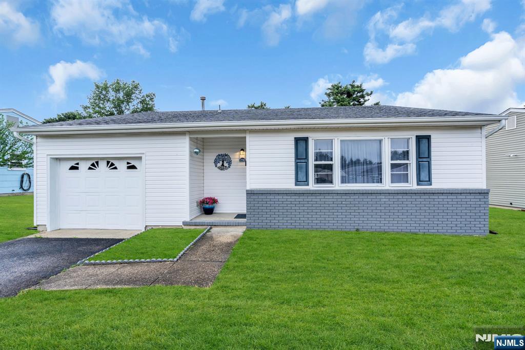 Beautifully renovated 2-bedroom home located in desirable adult community. This stunning home features a extended kitchen with white wood cabinetry, quartz countertops, a gorgeous backsplash and stainless-steel appliances - perfect for both everyday living and entertaining. Additional highlights include a beautifully updated full bathroom with a fully tiled walk-in shower. plus a convenient half bath for guests. Elegant laminate flooring flows through living room and kitchen. A pocket door provides added privacy to the bedroom area. Major updates include a new roof 2019 and windows and siding 2020, offering peace of mind for years to come. Just unpack and start to enjoy your next chapter