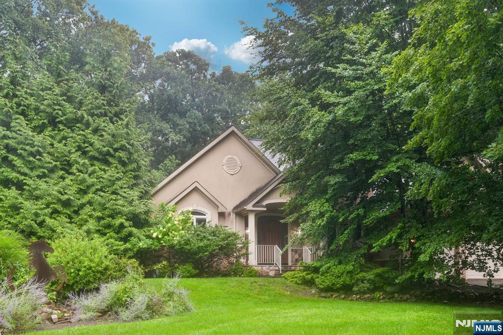 Built in 2001 at the end of cul-de-sac. Perfectly located just minutes from major highways and convenient transportation to NYC. This four bedroom home offers the perfect bland of of elegance, privacy and convenience. A two-story entry foyer welcomes you into a light-filled interior highlighted by stunning two-story great room with a beautiful fireplace, creating an inviting space for both everyday living and entertaining. The spacious first-floor primary suite provides comfort and privacy, featuring a well-appointed en-suite bath and generous closet space. Step outside to your own private backyard retreat, complete with in-ground pool surrounded by mature landscaping-an ideal setting for relaxing or hosting family and friends.
