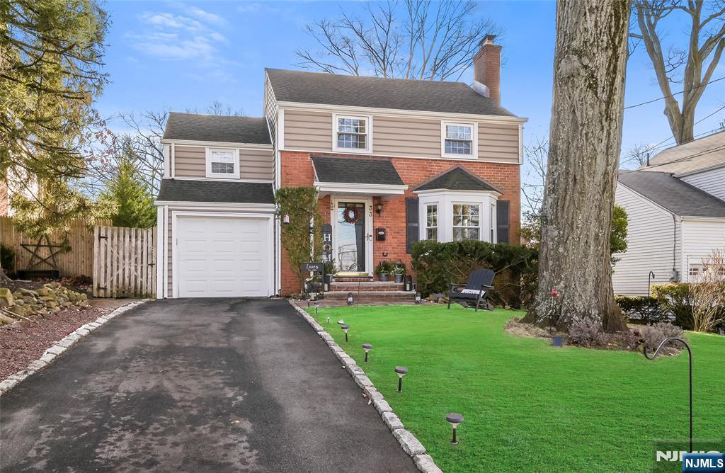 Charming 3 bedroom colonial nestled in a highly desirable neighborhood. This timeless residence features gleaming hardwood floors throughout, offering warmth and character in every room. The inviting living room is centered around a cozy wood burning fireplace, perfect for small gatherings & parties. The home boasts a layout including a spacious dining room ideal for entertaining, a charming functional kitchen with granite counters, and three bedrooms on the second floor. The main bathroom boasts a jetted tub. Outside, enjoy a private backyard with room for gardening or relaxation. Conveniently located nears schools, parks, shopping, and dining, this home combines classic elegance with comfort in a sought-after community. Downtown Cedar Grove and Verona are nearby. Only a few miles to major highways such as Rt. 46, 80 and 280. Don't miss out on this lovingly maintained home. Windows, gutters, roof, siding done in '17. Brand new Maytag refrigerator.