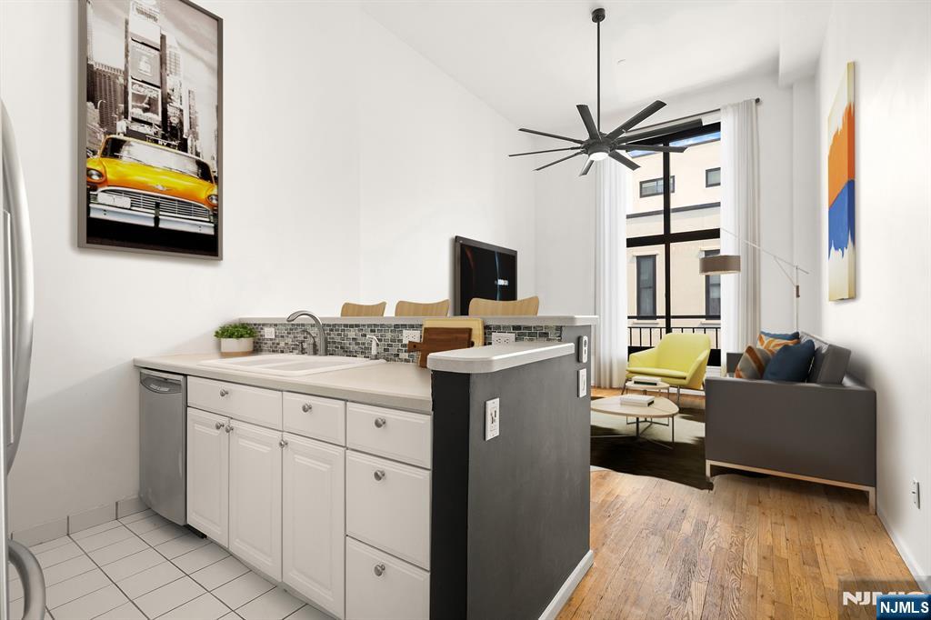 Step into Modern Style in this Fabulous Loft style 1 Bedroom+DEN Convertible 2 Bed 1 Bath Condo, Boasting attractive loft features. Surrounded by Urban Convenience in thriving Weehawken. This Modern loft style condo offers a tranquil oasis, on the top floor of the building. You will be amazed by a host of distinctive Loft features from soaring 15 ft+- ceilings to tremendous wall sized Windows that fill the Loft with sunshine & light. The open kitchen is ideal to cook in, dine in with newer SS appliances, cabinetry & ready for entertaining with an island/dining bar for gatherings. Travel upstairs to the Loft style den w/ dedicated sleeping space, home office/den. Embrace the flexibility of the Loft duplex, where you have the option to create a 2nd bedroom depending on your lifestyle. The Spacious & Serene Bedroom can accommodate a King sized bed, en suite walls of closets+dressing area w/ vanity & ensuite Modern full bath. An attractive industrial flair dangling light fixture is at the entrance foyer, a newer W/D, complete the floor-plan. Notable newer HVAC, Newer energy efficient thermal Windows, 1 car Garage Pking, Pet friendly. Discover Gregory Commons gated luxury condo complex. Amenities: 24hr concierge, Fitness ctr., Indoor Pool; Sauna; Lounge; courtyard. A Commuter Paradise-only 2-Miles to NYC PA via NJ transit Bus, NY Waterway or Car. Hassle free commuter options are just 2 blocks away. Contact Angela Cuciniello for Details Direct 201.657-6084. Don't Miss out!