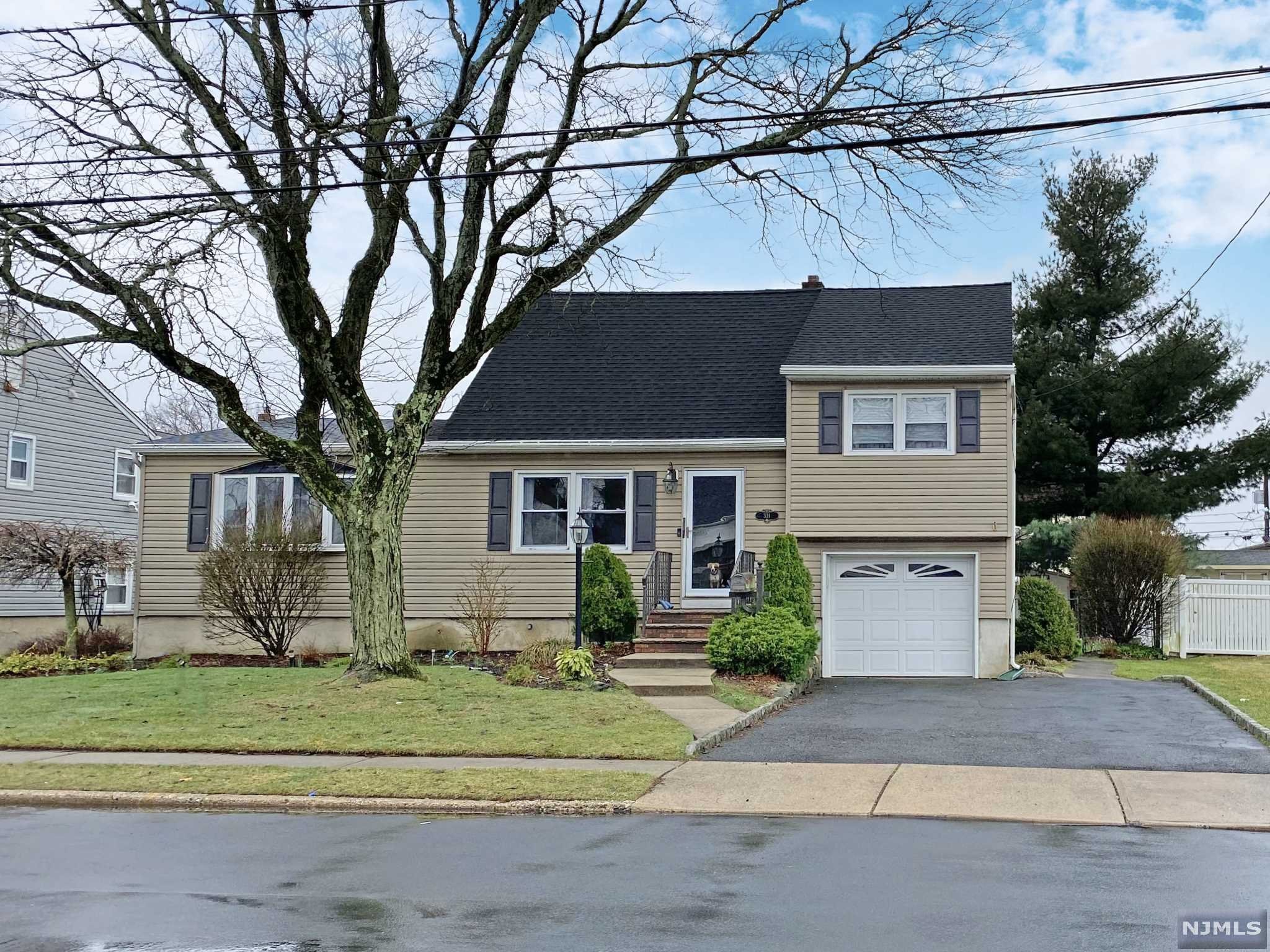 BACK ON MARKET! Welcome home to this fabulous 3 BR, 2 bath split on quiet street! Enter into oversized foyer/sitting room w/coat closet. Proceed into generous size living room w/HW floors & a beautiful bay window which provides an abundance of natural light! Updated kitchen w/ample counter space & room for table or island. Large inviting dining room with new pellet stove, great for entertaining. This level also includes a full bath! The second level consists of 2 large bedrooms w/ full bath & third level boasts one additional bedroom or office. Attic space through door in 3rd level bedroom. Garage entrance off kitchen which leads to laundry room and basement for storage & separate utility area. This home also features an attic fan, new roof, & large deck off kitchen w/above ground pool & fully fenced in yard. Pool has new liner and filter. Pool as-is. Close to major highways!