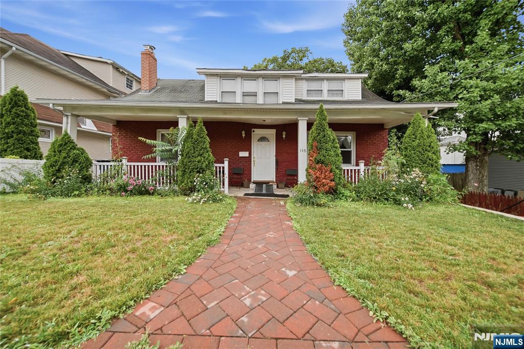 Charming Expanded Ranch Full of Character! This spacious 4 bed, 2 full-bath home features a covered front porch and brick paver walkway. Offering timeless character throughout, it's the perfect home to settle into and make your very own. A welcoming entry leads into a bright living room with tall ceilings, hardwood floors, and a warm brick fireplace as the centerpiece. The formal dining room shines with a chandelier and large windows that fill the space with natural light, perfect for entertaining. Two generous bedrooms on the main level offer easy, accessible living. Head upstairs to find two more bedrooms, including a spacious, oversized primary bedroom. The finished basement offers a full bath and separate entrance. Low Taxes!! Conveniently located just 2 blocks from Palisades Avenue for an easy commute!