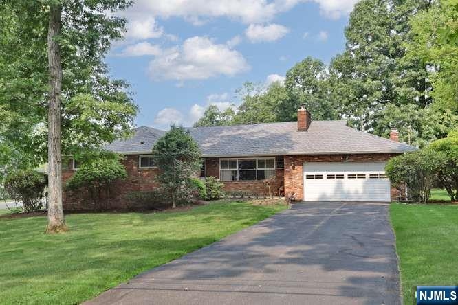 Welcome to 91 Rose Ave, a beautifully positioned 4-bedroom, 3-full bath residence in the heart of Woodcliff Lake. Set on a nearly half-acre, expansive flat lot, this home offers a tranquil lifestyle on a quiet, desirable street while keeping you connected to everything that matters. The homeâ€™s layout is uniquely functional, featuring a private 4th bedroom suite that is perfect for extended family, guests, or a home office. Separated from the main living area, this space includes its own full bathroom and a private garage entrance, offering the perfect blend of accessibility and independence. The home also features a Primary Suite with full bath, plus 2 wood burning fireplaces, and a part finished basement offering even more living space. Enjoy the best of suburban living near to top-rated schools and easy access to local parks, town pool, shops and worship. Commuters will appreciate the convenience, with the Woodcliff Lake train station just a short 3-minute drive away and NYC bus options nearby. This home truly balances peaceful, private living with the practicality needed for todayâ€™s lifestyle, with plenty of options for future expansion. Make this your home sweet home!
