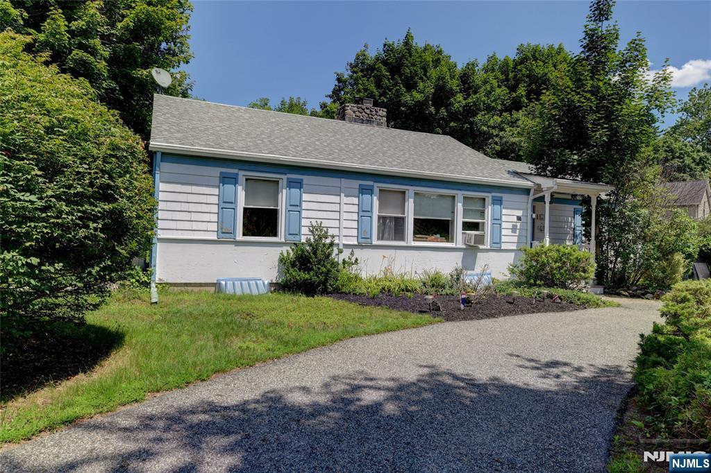Welcome to the highly desirable Cupsaw Lake community in scenic Ringwood! This charming 3 bedroom, 1.5 bath ranch is full of character and awaiting it's next owner's vision. Inside, you'll find a warm and inviting layout featuring built in shelving, an original tiled fireplace mantel and timeless details that add to the home's unique appeal. With a little TLC, this home offers incredible potential. Situated on a spacious 0.61 acre lot, the property features a circular driveway accented by nature privacy bushes, along with a peaceful pathway leading to a secluded garden area surrounded by lush greenery and beautiful wisteria. Enjoy all the Cupsaw Lake community has to offer, including a freshwater lake with swimming, boating, fishing, kayaking, as well as a vibrant clubhouse featuring the popular "Fabulous Friday" summer events. Conveniently located near hiking trails, parks, botanical gardens, and shopping, this is a wonderful opportunity to enjoy lake community living in the heart of Ringwood. Some photos have been virtually staged and digitally enhanced to illustrate the property's potential. Furnishings, decor, and enhancements shown in these images are for marketing purposes only and may not reflect the home's current condition.