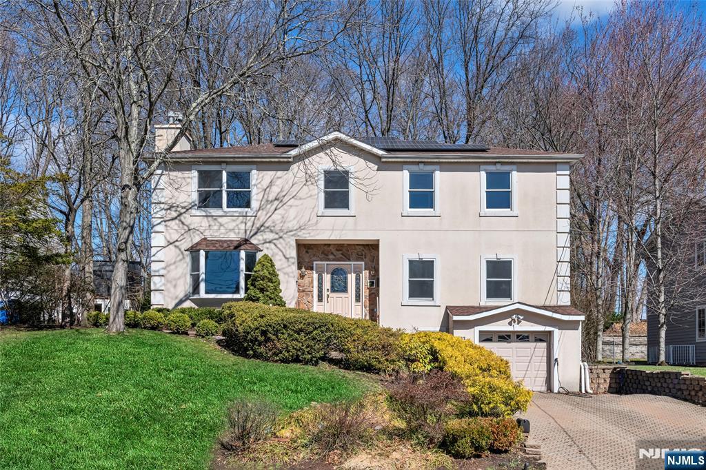 Located in the highly desirable town of Tenafly, this beautifully renovated 5-bedroom, 4-full bath home offers modern comfort, elegant finishes, and a flexible layout perfect for todayâ€™s lifestyle. Completely renovated in 2020, the home features an inviting entry foyer, a sun-filled living room with gas fireplace, formal dining room, and a stunning kitchen with oversized center island with seating, wine refrigerator, quartz countertops, stainless steel appliances, and breakfast area. This beautiful kitchen has abundant cabinetry and generous counter space. The first floor also includes a bedroom and full bath, ideal for guests, extended family, or office. The great room has french doors that overlook the backyard. The second floor offers a convenient laundry room, a luxurious primary suite with gas fireplace, two walk-in closets, and a beautifully appointed bath w double vanity, soaking tub, and separate shower. Three additional bedrooms and a full hallway bath complete the level. The finished basement includes a recreation room and full bath, providing excellent additional living space. Hardwood floors, recessed lighting, and detailed moldings throughout. Additional features include an Ecowater softener system and a 220 EV charging plug. Enjoy outdoor living in the private backyard, perfect for relaxing or entertaining. Located close to top-rated Tenafly schools, parks, shopping, and NYC transportation, this home combines space, convenience, and an exceptional location. .