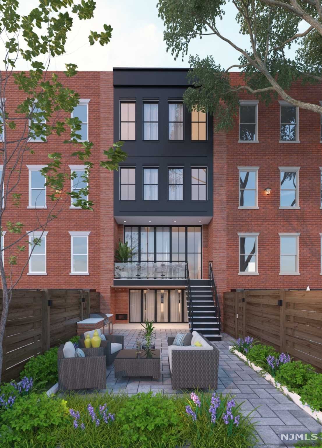 Design & craftsmanship mark this sophisticated four story, 20' wide elevator brownstone. Fully reimagined and custom built by a local boutique developer, this home is ideally located on tree-lined Bloomfield Street in the heart of Hoboken. Each element is being carefully selected to reflect developers' high standards for quality and design. This 4800 square feet of meticulous construction includes a spacious living room, five large bedrooms, four and a half baths, a home office, enormous theatre/family room with wet bar, storage, pantry, two laundry rooms, an abundance of walk-in closets, rift & quartered sawn white select oak hardwood, two terraces, private yard and roof deck. Gourmet kitchen with hand-crafted maple shaker cabinetry, natural maple interiors, pull out butcher block cutting board, custom drawer inserts, designer tile, quartz countertops. Sub-Zero refrigerator, Miele Speed Oven, Miele dishwasher, Wolf Range and hood along with Sub-Zero wine fridge.