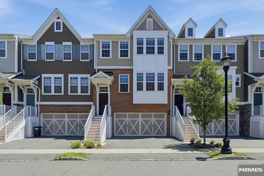 Beautifully maintained 3BR/3.5BA townhome offering approximately 2,000 +/- SF in one of Cresskills most sought-after communities. Perfectly positioned within the development, this highly desirable unit enjoys mature trees, peaceful views, and one of the most private outdoor settings in the community. The open-concept layout features hardwood floors, recessed lighting, a dramatic floor-to-ceiling stone electric fireplace, custom built-in office nook, oversized chefs kitchen with large center island, and dining area that opens to an oversized deck surrounded by greenery. The lower level includes a bonus room with full bath, patio access, and a private paver patio with gas line for grilling. Upstairs, the spacious primary suite offers a walk-in closet and spa bath, while two additional bedrooms and laundry complete the level. 2-car garage. Close to Cresskills top-rated schools, parks, shopping, dining, NJ Transit, and the George Washington Bridge.
