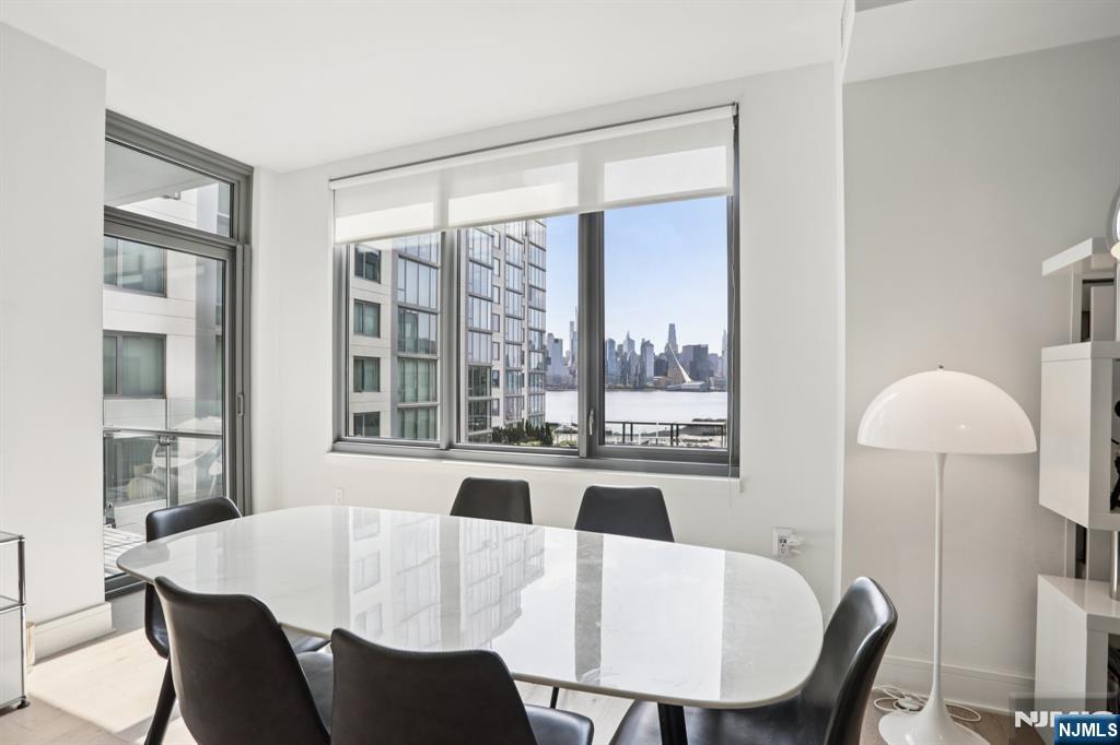 Nine on the Hudson is a premier luxury waterfront condominium located in Port Imperial, completed in 2018 and renowned for its upscale finishes, stunning Manhattan skyline views, and resort-style amenities. Residence #513 is a highly sought-after and rarely available floor plan. This spacious 2-bedroom + den, 2-bathroom home offers approximately 1,704 square feet of elegant living space, featuring breathtaking panoramic views of the New York City skyline from the main living area, primary suite, and private balcony. The open-concept layout is designed for both comfort and entertaining, highlighted by a modern kitchen with quartz countertops, Bosch appliances, and a Thermador refrigerator. Luxury amenities include a 24-hour doorman and concierge, resident lounge, two-story fitness center, sauna, childrenâ€™s playroom, Golf simulator, and party room. Landscaped courtyard with BBQ area, Outdoor swimming pool. Shuttle provides convenient access to the Port Imperial Ferry, making commuting to Manhattan effortless. This unit includes one parking space and one storage unit. WATER, HEAT, and AMENITY are included in rent.