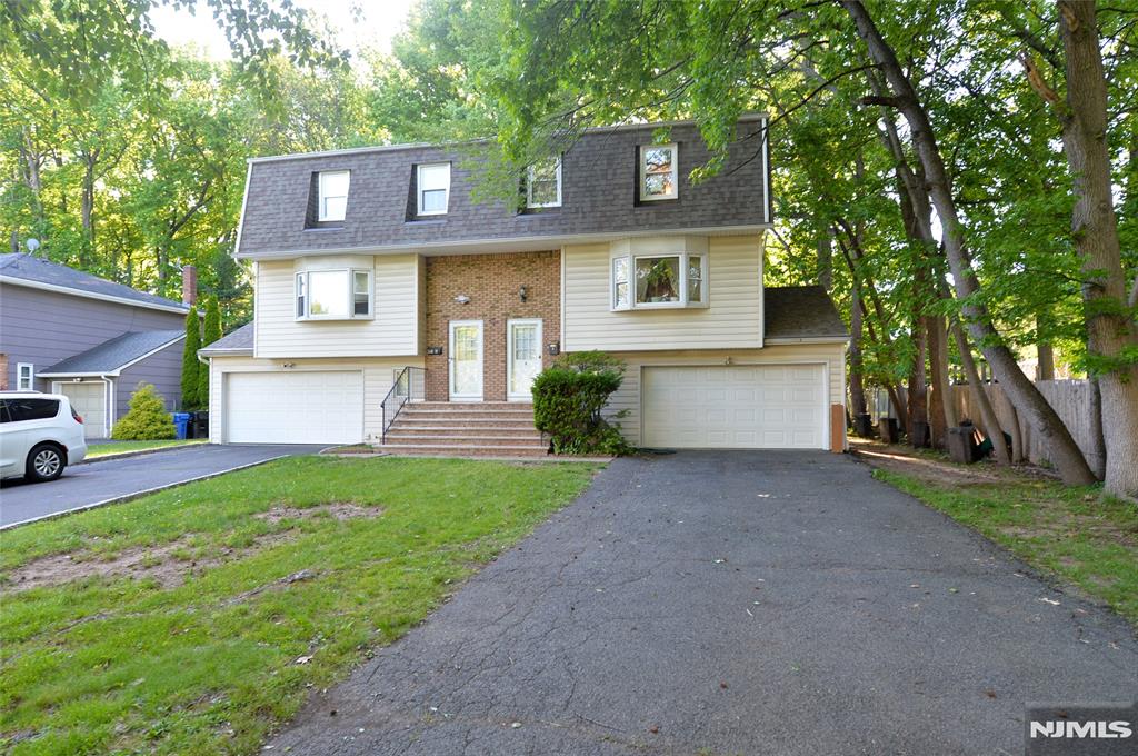 Located in a prime Paramus location on a quiet residential street, this lovely duplex ( unit B)offers 3 bedrooms, 2 full baths, and 2 half baths. The first floor features an open layout with a spacious living and dining area, a kitchen with granite countertops and stainless steel appliances, and abundant natural light throughout. The second floor offers a primary suite with a full bath, two additional generously sized bedrooms, and a full bath. The ground level includes a comfortable den, a half bath, and a flexible space ideal for a home office. Recent updates include a new roof (2025) and central air conditioning (2025). Whether you're looking for an investment opportunity or a place to call home, this property offers exceptional value in one of Paramus' most desirable neighborhoods. Please note: Units A and B are condominium units with separate deeds.