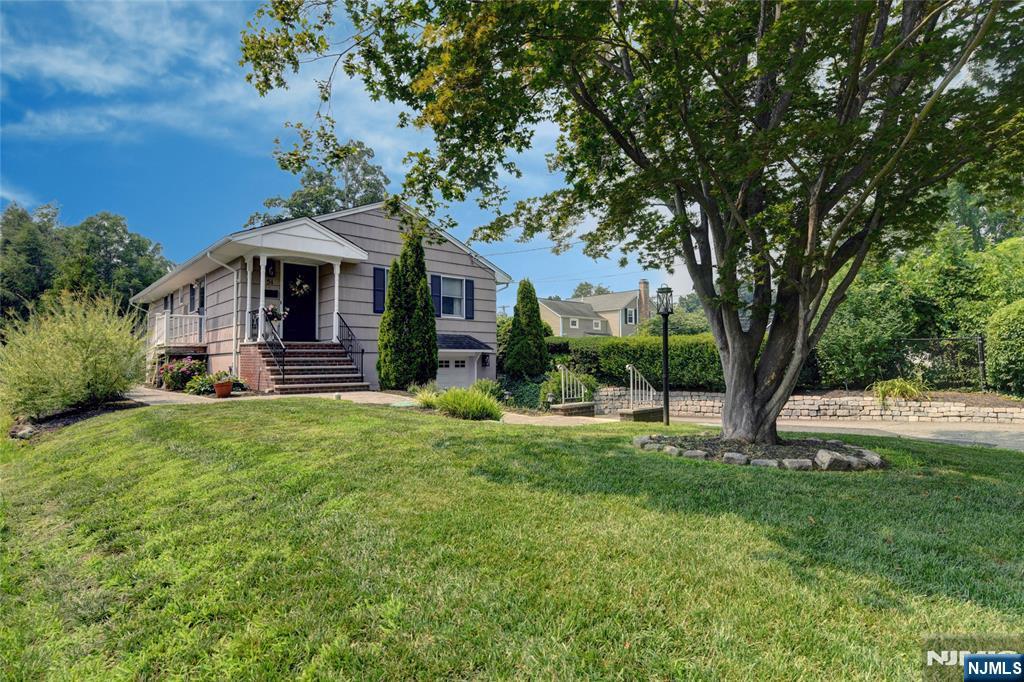 Welcome to this impeccably maintained 3-bedroom, 1.5-bath ranch nestled in the heart of Pompton Plains. From the moment you arrive, you'll appreciate the pride of ownership, highlighted by professionally landscaped grounds and exceptional curb appeal. Inside, this spotless home offers a bright, open floor plan featuring a light & bright Living Rm open to the Dining Rm and Kitchen. The flow is just perfect for entertaining. Beautiful moldings, gleaming wood floors, and tasteful finishes add warmth and character throughout. Newly updated Kitchen offering maximum storage, granite counters and newer SS appliances.3 generously sized bedrooms and plenty of closets. The main bath room is tastefully renovated and the primary bedroom offers a convenient 1/2 bath. Lower level has a nice size Family Rm with loads of lighting, Laundry, storage rm and access to the garage as well. Many fine upgrades include, central AC (2020), a newer septic (2021), Paver Walkway & Patio. Natural Gas Grill included. Ideally located, you'll enjoy the convenience of an NYC bus stop near by, easy access to major highways, shopping, restaurants, and highly regarded Pequannock Township schools. Outdoor enthusiasts will love being just moments from the scenic Pompton Valley Rail Trail, offering miles of walking, jogging, and biking opportunities. This is a wonderful opportunity to own a meticulously cared-for home in a sought-after community that combines small-town charm with unbeatable convenience.