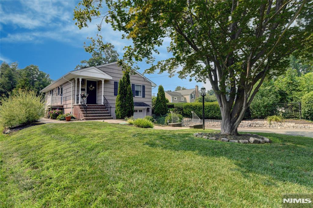 Welcome to this impeccably maintained 3-bedroom, 1.5-bath ranch nestled in the heart of Pompton Plains. From the moment you arrive, you'll appreciate the pride of ownership, highlighted by professionally landscaped grounds and exceptional curb appeal. Inside, this spotless home offers a bright, open floor plan featuring a light & bright Living Rm open to the Dining Rm and Kitchen. The flow is just perfect for entertaining. Beautiful moldings, gleaming wood floors, and tasteful finishes add warmth and character throughout. Newly updated Kitchen offering maximum storage, granite counters and newer SS appliances.3 generously sized bedrooms and plenty of closets. The main bath room is tastefully renovated and the primary bedroom offers a convenient 1/2 bath. Lower level has a nice size Family Rm with loads of lighting, Laundry, storage rm and access to the garage as well. Many fine upgrades include, central AC (2020), a newer septic (2021), Paver Walkway & Patio. Natural Gas Grill included. Ideally located, you'll enjoy the convenience of an NYC bus stop near by, easy access to major highways, shopping, restaurants, and highly regarded Pequannock Township schools. Outdoor enthusiasts will love being just moments from the scenic Pompton Valley Rail Trail, offering miles of walking, jogging, and biking opportunities. This is a wonderful opportunity to own a meticulously cared-for home in a sought-after community that combines small-town charm with unbeatable convenience.