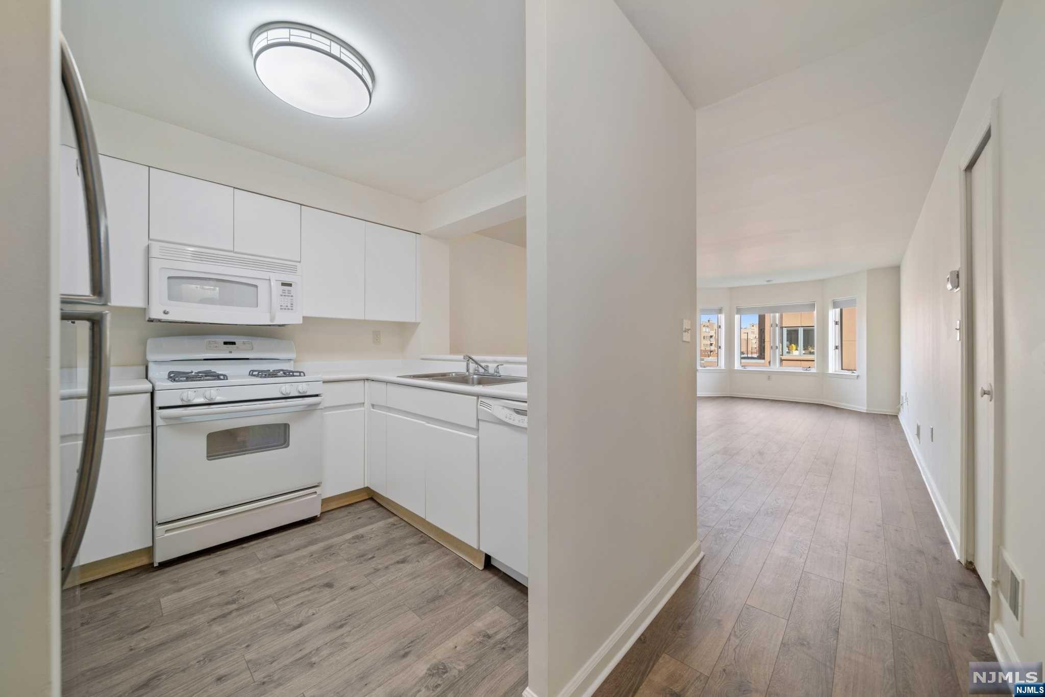**TOM MCCARTHY & The Chen Agency** present: Independence Harbor's desirable corner 1 BR, 1 Bath home facing East. There is a terrace off the master bedroom which also has a walk-in closet. Apartment has newer appliances, brand new flooring has been freshly painted and cleaned. Pool, exercise Rm, tennis, NYC public transportation at front. Due at lease signing: 1st month rent, 1.5 month security, 1-month broker fee, $500 building move-in fee, $500 refundable moving day damage deposit to the building. Call or text TOM MCCARTHY 201-206-8144 for all showings.