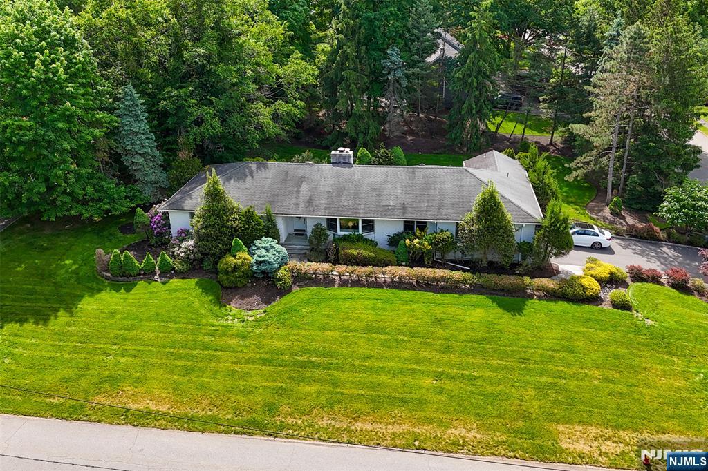 Large ranch on a great corner property on Feldstone Pl. and Woodland Rd. in a very desirable area of West Caldwell, located just minutes from Bloomfield Ave. Ample space inside and outside for both relaxation and entertainment. Mother-daughter potential.