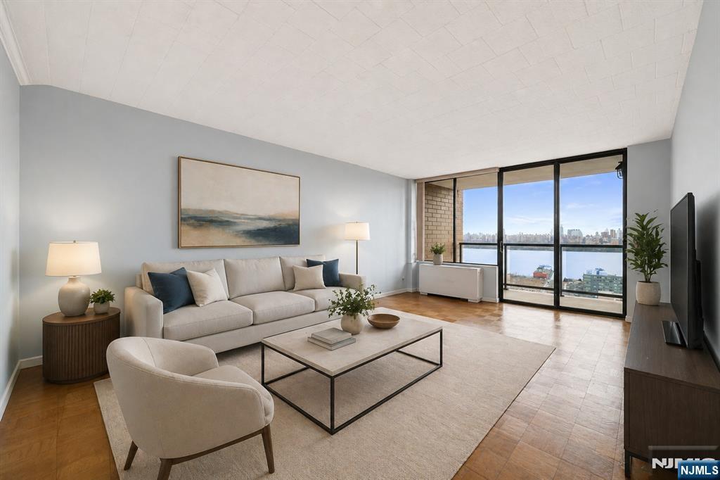 Contact Rita Hsing ( 646-639-2856 ) for showing appointment today! Welcome to Residence 507 at Park Hudson. This spacious, sun-drenched deluxe two-bedroom, two-bath home offers 1,240 square feet of thoughtfully designed living space. The oversized southeast-facing residence features breathtaking, unobstructed views of the Hudson River and the iconic New York City skyline from every windows, as well as from your private terrace. The excellent layout includes a separate dining room with stunning vistas, a modern updated kitchen equipped with stainless steel appliances, and generous living areas ideal for both everyday comfort and entertaining. Abundant closet space throughout provides exceptional storage. This is a rare opportunity to enjoy remarkable space, natural light, and spectacular panoramic views in every direction. Monthly maintenance of $1,325 includes all utilities-gas, electric, water, hot water, cable, and internet along with full-service amenities such as a 24-hour concierge service, outdoor pool, fitness center, and laundry room. Garage parking is available for an additional $125 per month. Park Hudson perfectly situated near restaurants and public transportation, Park Hudson is also moments from James J. Braddock North Hudson County Park, a scenic 167-acre lakefront retreat offering skyline views, sports facilities, and walking trails.