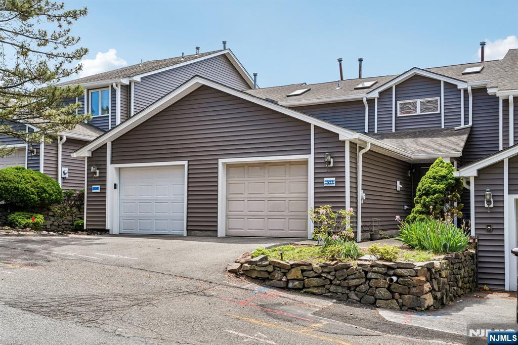 Immaculate and spacious 3 Bedroom, 2.1 Bath townhome located in the quiet and private Haledon Heights community offering stunning skyline views from your private deck! This multi-level home features a ground level with 2 Bedrooms, Full Bath, and Laundry area. The main living level offers a bright and airy Living room with Fireplace, Formal Dining room, Kitchen, and Powder room. The second floor features a spacious Master Bedroom with Master Bath and Loft area. Large finished basement includes a Family room, perfect for additional living and entertaining space. Home also features new siding, 1-car garage, and so much more. A true must see!