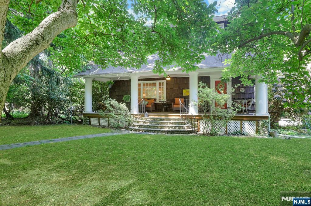 Unique in every way! This historic Colonial rests on a cul-de-sac with continuing access to the street behind it! Wooded lot with beautiful in-ground pool, private gardens, patios and deck... truly a peaceful sanctuary! The home has two entrances with the lemonade front porch facing the private wooded side of the property. Enter into a charming and cozy living spaces on the main level with original architectural details and craftsmanship. Wood-burning fireplace in living room. Raised Family Rm with wood stove overlooks the gorgeous pool area! Updated kitchen features granite countertops and stainless appliances, a pantry closet and a separate coffee bar. Eat-in breakfast area has sliders to a barbecue deck overlooking the backyard and pool, steps down to the HUGE pool patio and gunite in-ground pool. Upstairs are three large bedrooms, including primary BR with en-suite bathroom and cedar closet. Basement is finished as Laundry and Home Office/Gym area. The home has two driveways, one leading to the 2-car garage, and a shared driveway and dirt road with access to Yesler Way. Truly a unique home and property that combines old world charm and details with modern amenities and privacy. Must see it in person!